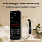 A Actyraxer Tracker Bracelet with a metallic mesh strap and rectangular display is shown beside a smartphone displaying a heart rate app. The scene is styled on a soft beige fabric with white flowers, with headline text at the top reading '24-Hour Intelligent Heart Rate Monitoring.