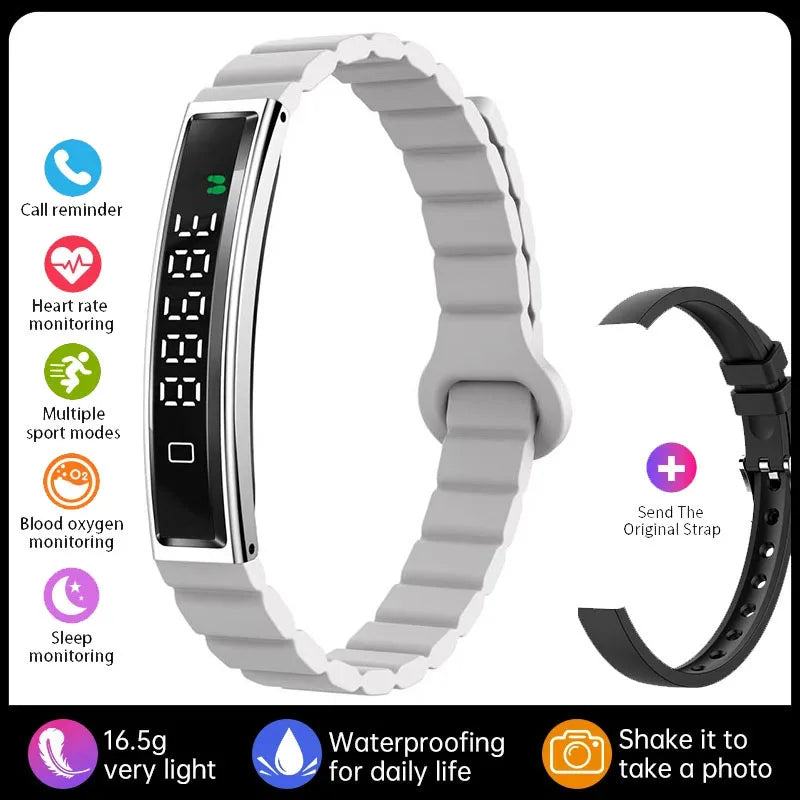 Actyraxer Tracker Bracelet with gray band and additional black band on a white background