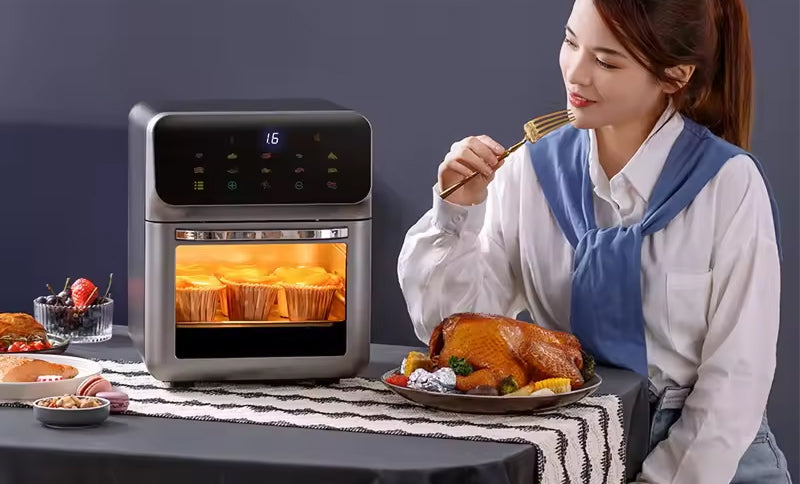 Woman enjoying a meal next to an AeriBlaz Air Fryer with muffins cooking inside.