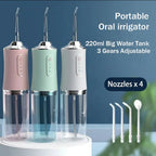 AquaBriska Water Flosser with three different colored units and nozzles on a blue background.