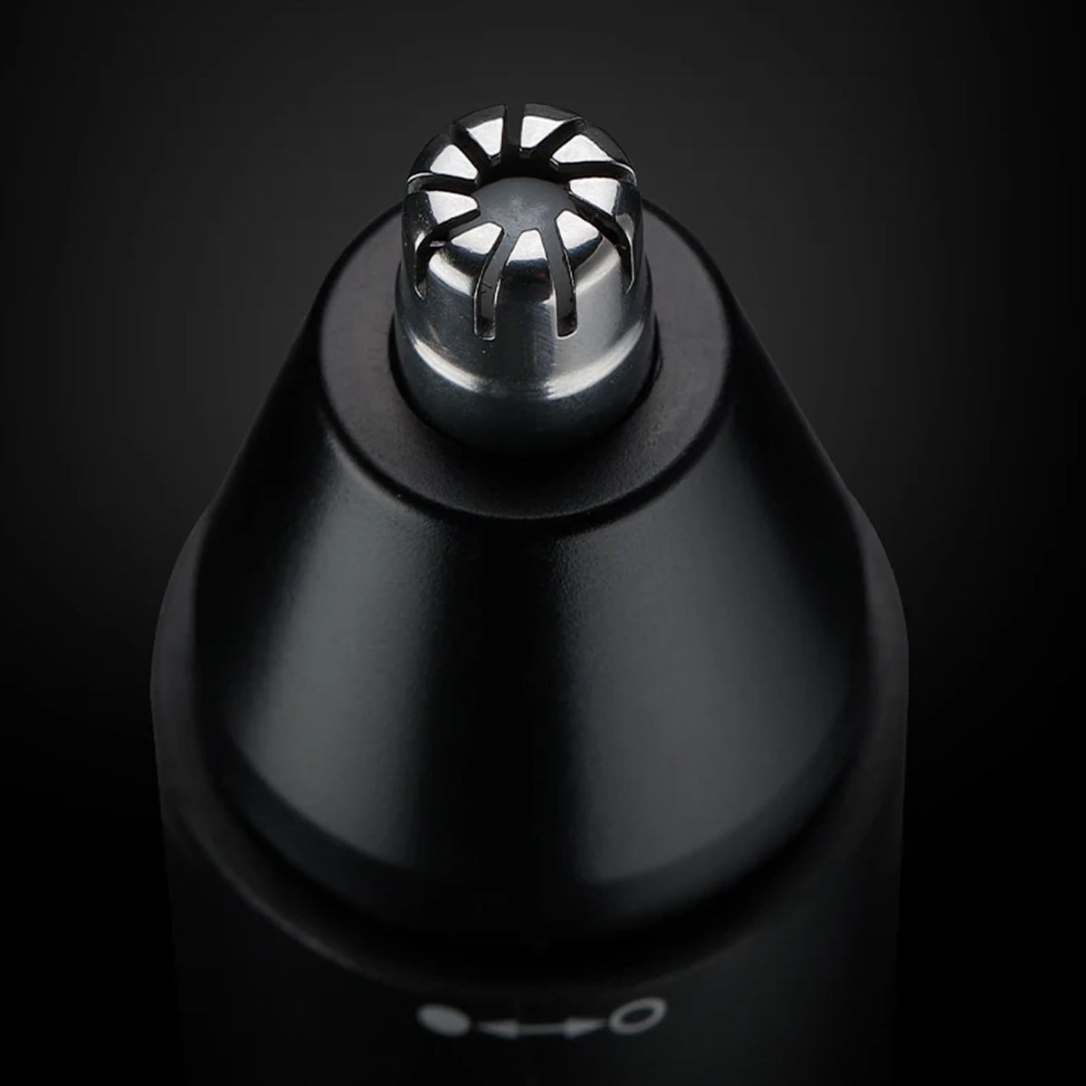 Black and silver  ClipCrazie Nasal Hair Trimmer head on a black background