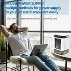 Person using a laptop with a GlaciVyex Portable Air Conditioner in a modern room.