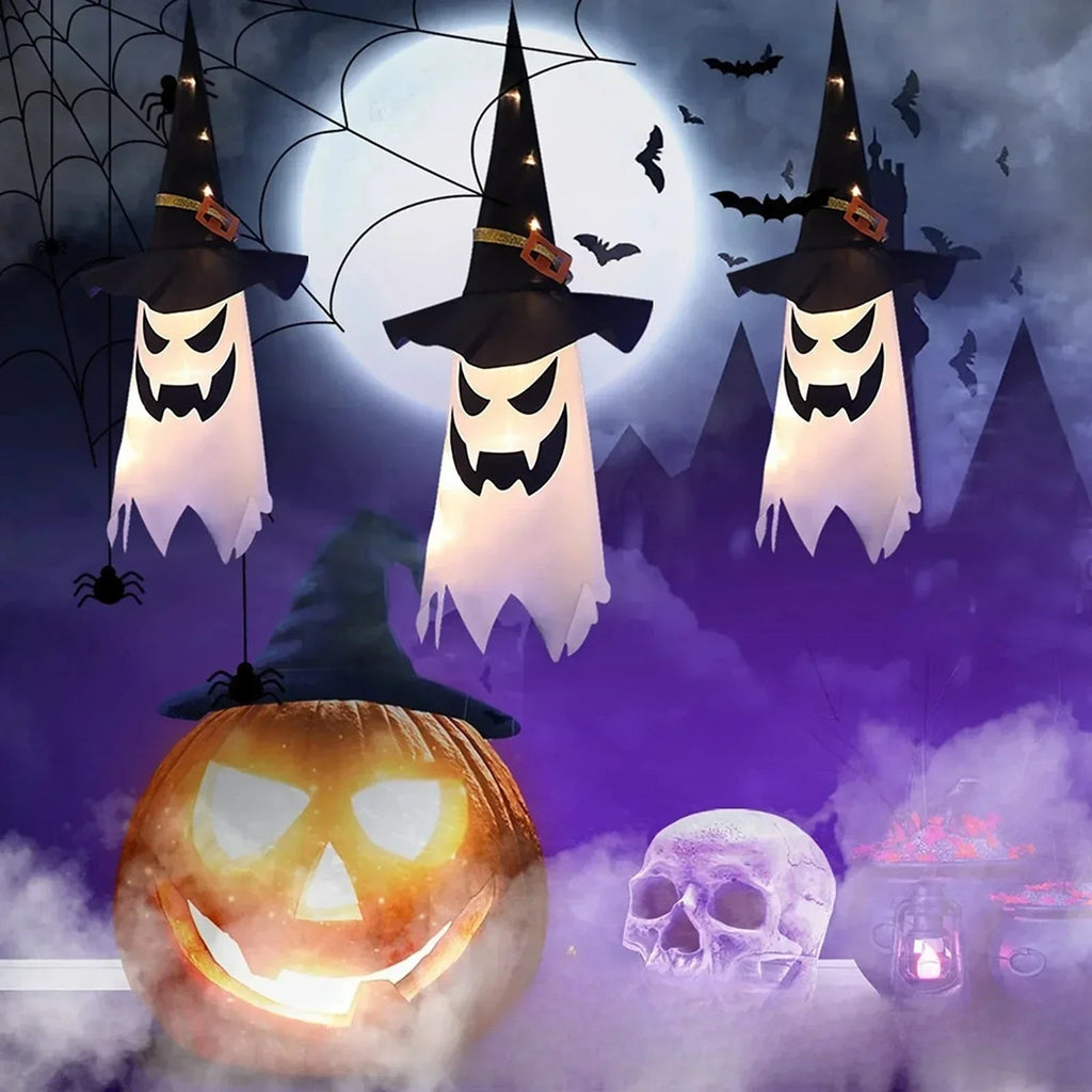 HexWitchi Jack O Lantern with ghosts, a pumpkin, and a skull against a dark sky.