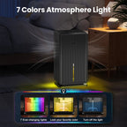 MoisTrixe Portable Dehumidifier stands in a dimly it living room, with text reading '7 Colors Atmosphere Light' above it and three colored light examples shown at the bottom. The scene is designed to show the product's ambient lighting feature rather than a clean isolated studio shot.