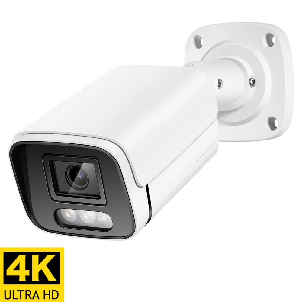 A SpotKamyl Spotlight Camera with a black front lens area and a wall mounting bracket, shown on a white background with a yellow 4K Ultra HD badge in the lower-left corner.
