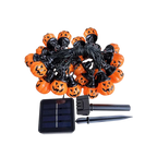 Solar-powered Sunpikoex Solar Pumpkin Lights featuring orange pumpkin-shaped bulbs with black jack-o'-lantern faces, connected by a black wire with a small solar panel and black ground stakes on a white background.