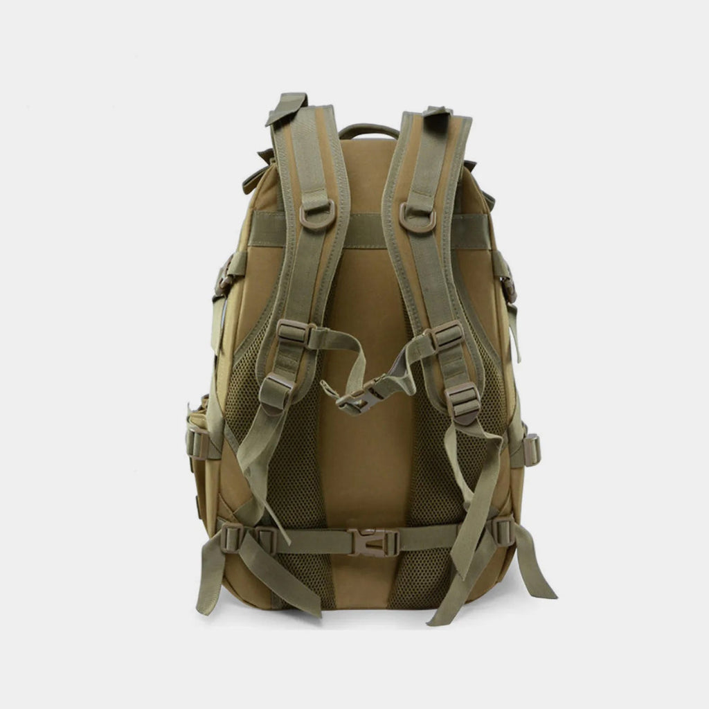 The back view of The Trekorago Hunting Backpack in olive drab and tan, featuring padded shoulder straps, mesh ventilation panels, and multiple adjustable buckles, set against a plain light gray background.